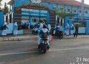 Satlantas Polres Bima Kota Bantu Anak Sekolah Menyeberang Jalan dalam Gatur Pagi