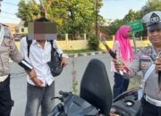 Personel Sat Lantas Amankan Pembawa Panah saat Rawan Pagi di Bima Kota